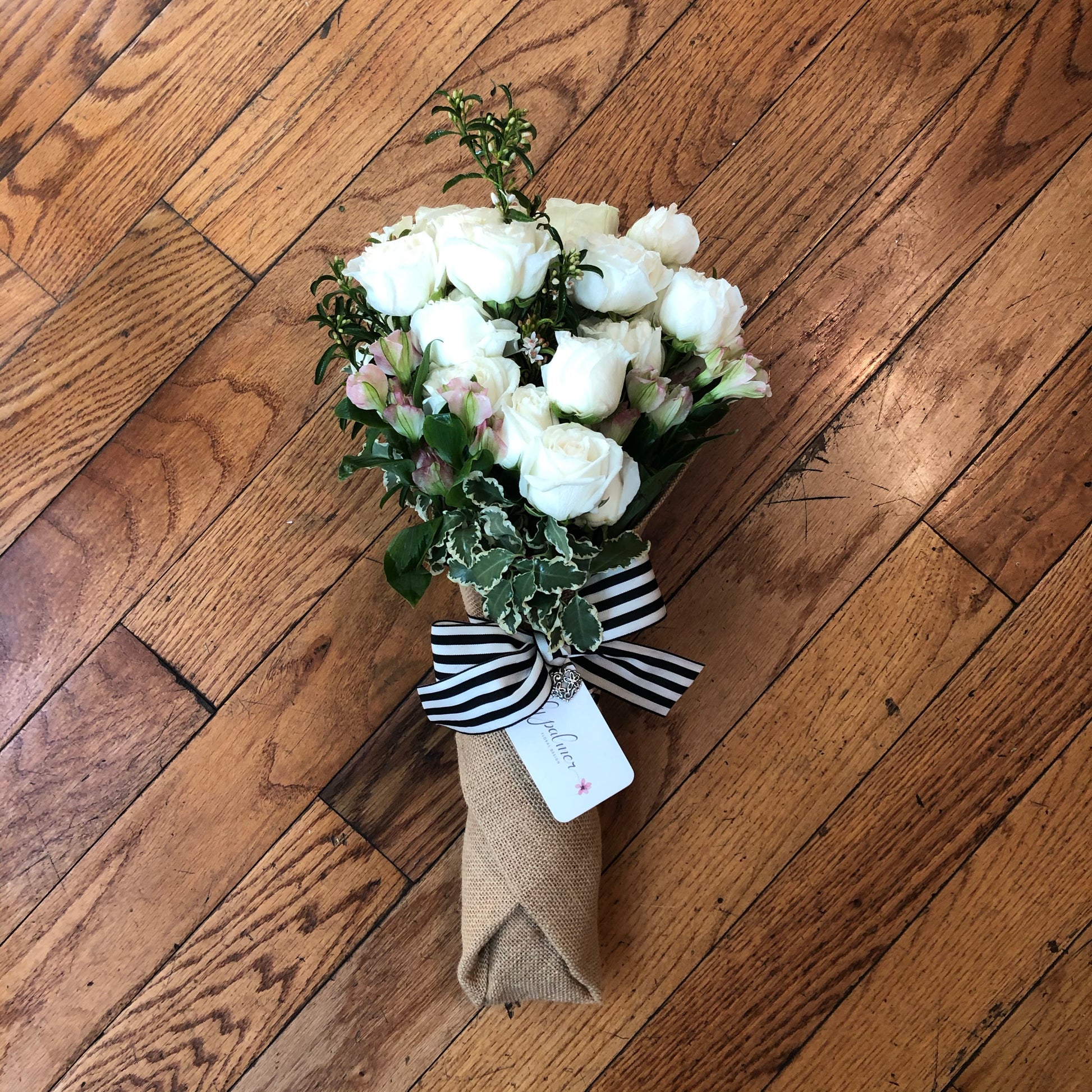 The Lily Wrap from Lily Palmer Flowers is filled with bunches of roses or seasonal flowers. The perfect gift for birthdays, special moments or just because.