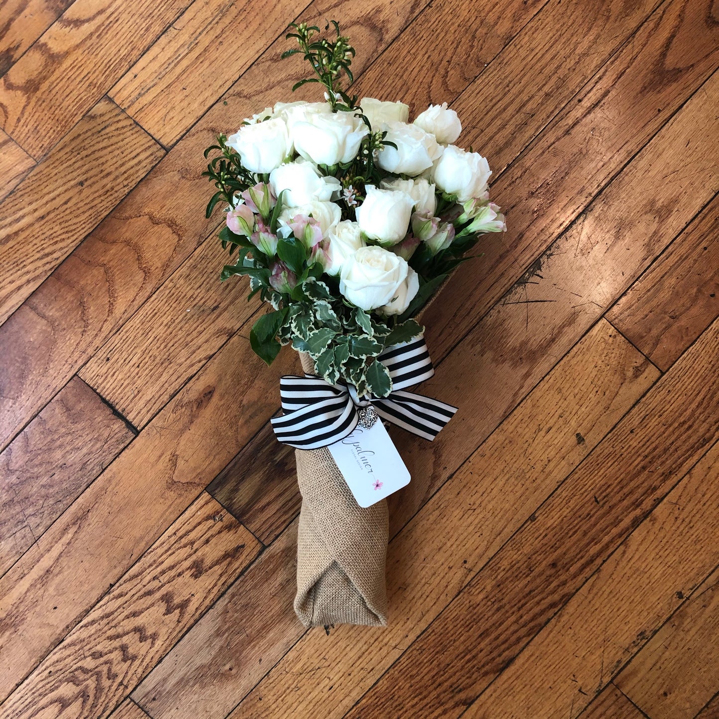 The Lily Wrap from Lily Palmer Flowers  is filled with bunches of roses or seasonal flowers. The perfect gift for birthdays, special moments or just because.
